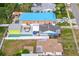 Aerial view of colorful homes with a shared fence, pool, and outdoor spa at 342 Euclid Ave, Daytona Beach, FL 32118