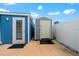 Backyard featuring storage sheds and a white privacy fence, providing ample outdoor space at 342 Euclid Ave, Daytona Beach, FL 32118