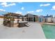Outdoor space with hot tub, dining area, a sunroom, and an in-ground swimming pool at 342 Euclid Ave, Daytona Beach, FL 32118