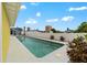 Backyard featuring a swimming pool, surrounding properties, and a white privacy fence at 342 Euclid Ave, Daytona Beach, FL 32118