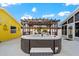 Backyard boasting a hot tub with a wooden pergola, surrounded by lush landscaping and sunny skies at 342 Euclid Ave, Daytona Beach, FL 32118