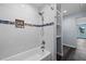 Bright bathroom with modern shower, blue tiled accents, and updated fixtures at 342 Euclid Ave, Daytona Beach, FL 32118