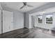 A well-lit bedroom boasting wood flooring, a ceiling fan, double windows and closet space at 342 Euclid Ave, Daytona Beach, FL 32118