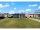 Charming exterior view of a home with a well-kept lawn, driveway, and a colorful design at 342 Euclid Ave, Daytona Beach, FL 32118