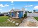 Exterior showcasing a cozy home with a neat front yard, stepping stone pathway, and driveway at 342 Euclid Ave, Daytona Beach, FL 32118
