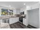 Well-equipped kitchen with stainless appliances, stone backsplash and wood-look floors at 342 Euclid Ave, Daytona Beach, FL 32118