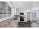 Modern kitchen featuring stainless appliances, granite countertops, and wood-look floors at 342 Euclid Ave, Daytona Beach, FL 32118