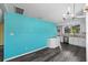 Spacious kitchen with granite countertops, modern appliances, and stylish blue accent wall at 342 Euclid Ave, Daytona Beach, FL 32118