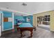 Large living area with view of patio and hot tub, featuring a pool table and bunk beds at 342 Euclid Ave, Daytona Beach, FL 32118