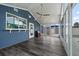 Enclosed sunroom with ceiling fan, ample windows and access to outdoor living spaces at 342 Euclid Ave, Daytona Beach, FL 32118
