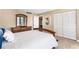 Cozy bedroom featuring a full closet and warm inviting decor at 3743 S Atlantic Ave # 11D, Daytona Beach Shores, FL 32118