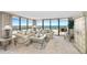 Well-lit living room featuring neutral tones and expansive water views at 3743 S Atlantic Ave # 11D, Daytona Beach Shores, FL 32118
