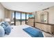 Bright main bedroom features large windows, beautiful views and a stylish decor with a sitting area at 3743 S Atlantic Ave # 11D, Daytona Beach Shores, FL 32118