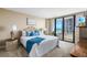 Comfortable main bedroom features large windows, beautiful ocean view and a stylish decor at 3743 S Atlantic Ave # 11D, Daytona Beach Shores, FL 32118