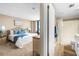 Comfortable main bedroom features ocean view and ensuite bathroom at 3743 S Atlantic Ave # 11D, Daytona Beach Shores, FL 32118