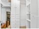 Spacious walk-in closet provides ample shelving and storage space at 3743 S Atlantic Ave # 11D, Daytona Beach Shores, FL 32118