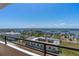 A balcony view overlooking tranquil waters and charming homes in a vibrant seaside community at 3743 S Atlantic Ave # 11D, Daytona Beach Shores, FL 32118
