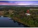 Aerial view of the property located in a secluded area at 37918 N County Road 44A, Eustis, FL 32736