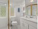 Cozy bathroom featuring white tile and a floral accent at 37918 N County Road 44A, Eustis, FL 32736