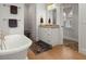Elegant bathroom features a soaking tub, granite countertop vanity and step-in shower at 37918 N County Road 44A, Eustis, FL 32736