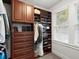 Walk-in closet with custom shelving, drawers, and cabinets, offering ample storage space and organization at 37918 N County Road 44A, Eustis, FL 32736