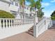 Stunning white home with intricate balustrades, staircases, and lush landscaping at 37918 N County Road 44A, Eustis, FL 32736