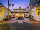 Lovely exterior of the home with palm trees and lush greenery with a fountain in the front at 37918 N County Road 44A, Eustis, FL 32736