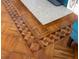 Detailed woodwork of parquet flooring with intricate geometric patterns surrounds a hearth at 37918 N County Road 44A, Eustis, FL 32736