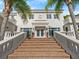 Grand home entrance with a brick staircase and manicured landscaping at 37918 N County Road 44A, Eustis, FL 32736