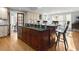 Spacious kitchen with a large island, stainless steel sink, and elegant cabinetry at 37918 N County Road 44A, Eustis, FL 32736