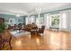 Spacious living room with detailed parquet floors, comfortable seating, and views to exterior at 37918 N County Road 44A, Eustis, FL 32736