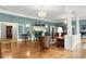 Spacious living room with a fireplace, hardwood floors, and elegant decor at 37918 N County Road 44A, Eustis, FL 32736
