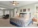 Spacious main bedroom with neutral tones, a ceiling fan, and ample natural light at 37918 N County Road 44A, Eustis, FL 32736