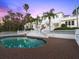 A refreshing pool is surrounded by brick pavers and a pristine, white decorative fence at 37918 N County Road 44A, Eustis, FL 32736