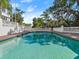 Beautiful pool with brick trim and white balustrade under a sunny sky at 37918 N County Road 44A, Eustis, FL 32736