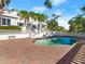 Stunning home exterior featuring a beautiful pool and brick patio, perfect for outdoor relaxation and entertaining at 37918 N County Road 44A, Eustis, FL 32736