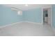 Spacious basement area featuring white marble-look flooring and light blue walls at 401 N Oleander Ave, Daytona Beach, FL 32118