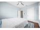 Cozy bedroom featuring a ceiling fan, light blue walls and a rug on the floor at 401 N Oleander Ave, Daytona Beach, FL 32118