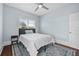 Well-lit bedroom featuring light blue walls, rug, and window bringing in natural light at 401 N Oleander Ave, Daytona Beach, FL 32118