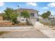 Two-story home with brick-lined garden beds and an attached garage at 401 N Oleander Ave, Daytona Beach, FL 32118