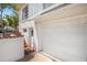 Detached garage with a door for backyard access and brick accents at 401 N Oleander Ave, Daytona Beach, FL 32118