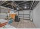 Spacious unfinished garage interior with rolling garage door and a lone chair at 401 N Oleander Ave, Daytona Beach, FL 32118