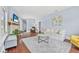 Bright living room with fireplace, hardwood floors, and neutral decor at 401 N Oleander Ave, Daytona Beach, FL 32118