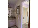 Updated bathroom with a shower, vanity, and tiled floor at 486 S Us Highway 1, Oak Hill, FL 32759