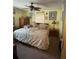 Cozy bedroom features a ceiling fan, carpet and various decor at 486 S Us Highway 1, Oak Hill, FL 32759