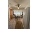 Cozy dining area with a round table, chairs, and natural light from the nearby window at 486 S Us Highway 1, Oak Hill, FL 32759
