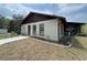 Charming single-story home with a screened porch and a newly landscaped yard at 486 S Us Highway 1, Oak Hill, FL 32759