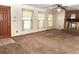 Cozy living room with a brick fireplace and large windows at 486 S Us Highway 1, Oak Hill, FL 32759