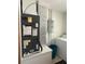 Functional laundry room with modern appliances; also includes an HVAC and electric panel at 486 S Us Highway 1, Oak Hill, FL 32759