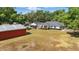 Overhead shot of home, pool, and outbuilding on large lot with plenty of yard space at 5865 Ross Creek Rd, Lakeland, FL 33810